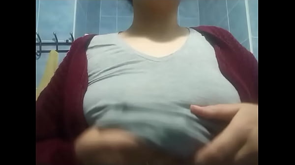 Horny woman caresses her breasts