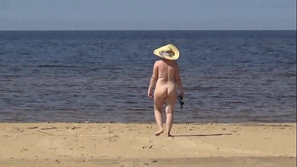 Naked hot MILF on a nude beach